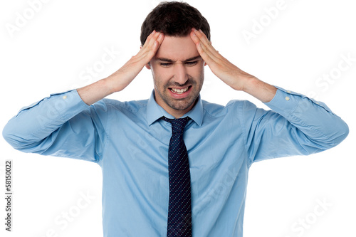 Photo: Man having severe headache Man having severe headache