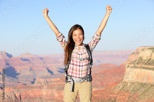 Photo: Happy winner hiker woman in Grand Canyon cheering Happy winner hiker woman in Grand Canyon cheering