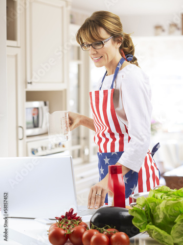 Photo: Happy woman cooking Happy woman cooking