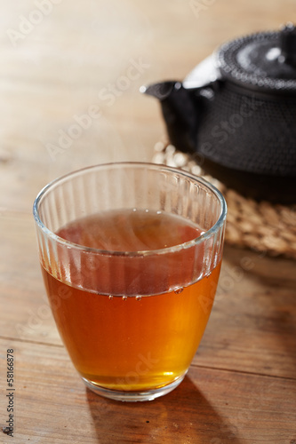 Photo: Brown tea on glass cup Brown tea on glass cup