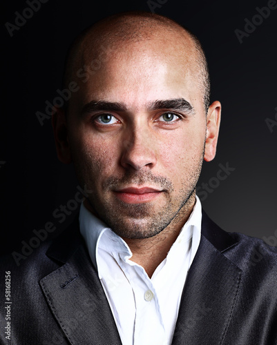 Photo: Portrait of handsome stylish man in elegant black suit Portrait of handsome stylish man in elegant black suit