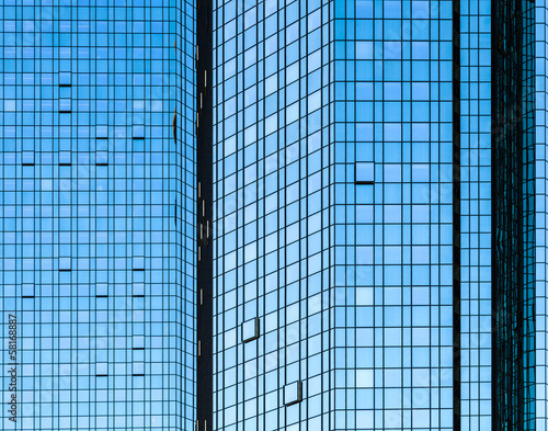 Photo: facade of skyscraper with sun reflections facade of skyscraper with sun reflections