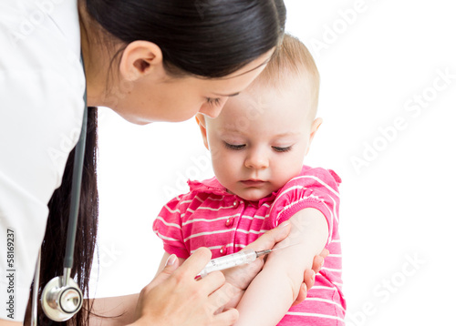 Photo: doctor injecting baby isolated doctor injecting baby isolated