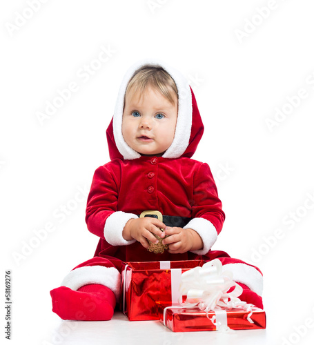 Photo: x-mas baby girl opening gift box isolated x-mas baby girl opening gift box isolated