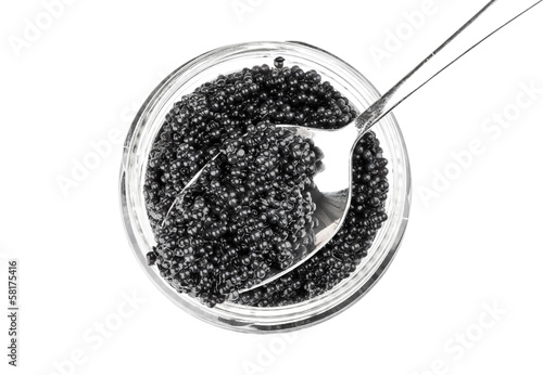 Photo: Black caviar in a glass jar with spoon. Top view Black caviar in a glass jar with spoon. Top view