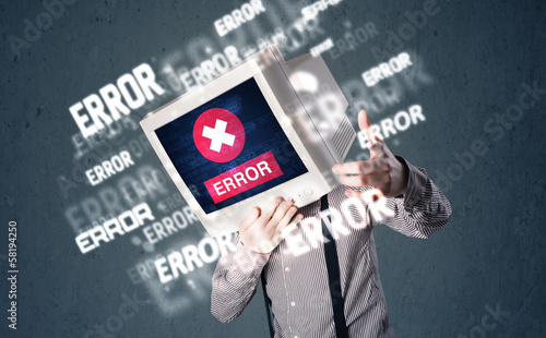 Photo: Business man with pc monitor on his head and error messages on t Business man with pc monitor on his head and error messages on t