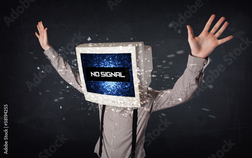 Photo: Man with a monitor head, no signal sign on the display Man with a monitor head, no signal sign on the display