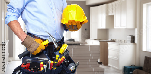 Photo: Handyman with a tool belt. Handyman with a tool belt.