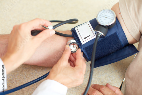 Photo: Blood pressure measuring. Blood pressure measuring.