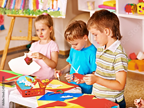 Photo: Child cutting out scissors paper. Child cutting out scissors paper.