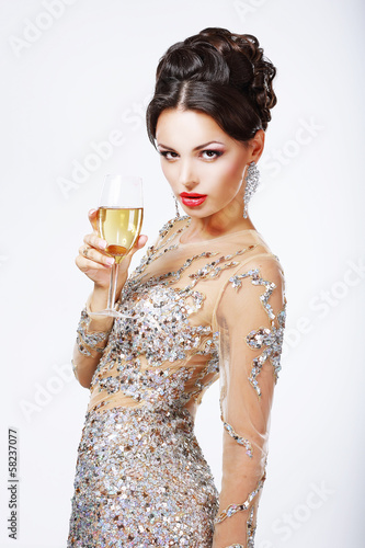 Photo: Elegant woman with a glass of champagne. Elegant woman with a glass of champagne.