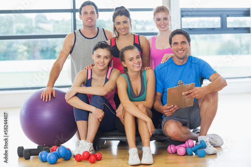 Photo: Portrait of an instructor with fitness class Portrait of an instructor with fitness class