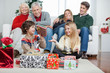Family With Christmas Presents At Home Family With Christmas Presents At Home