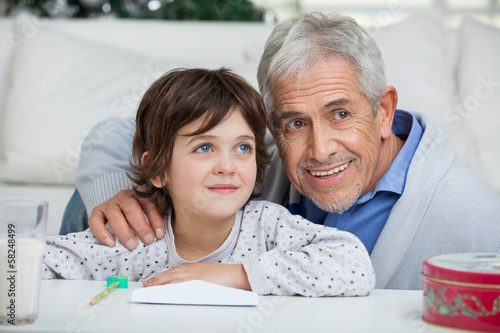Photo: Boy And Grandfather With Envelope Smiling Boy And Grandfather With Envelope Smiling