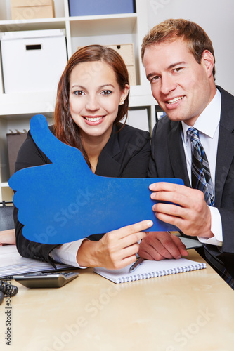 Photo: People holding I like thumbs up People holding I like thumbs up