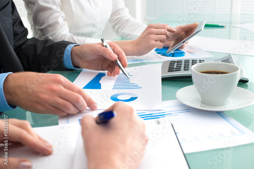 Photo: Discussing financial document Discussing financial document