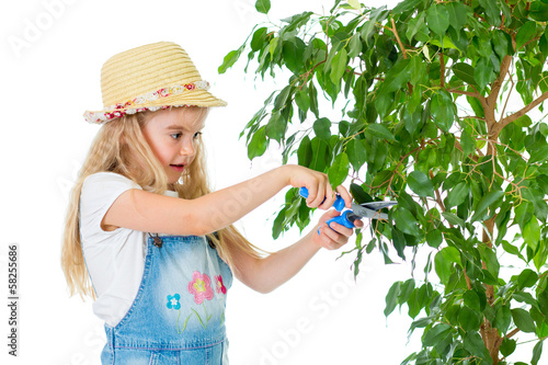 Photo: gardener kid caring at tree gardener kid caring at tree