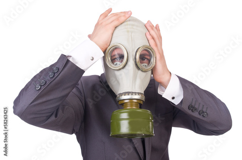Photo: Businessman wearing gas mask isolated on white Businessman wearing gas mask isolated on white