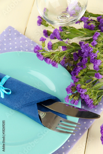 Photo: Table serving on a wooden background Table serving on a wooden background