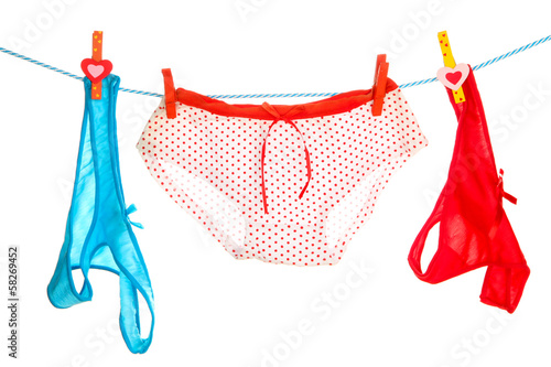 Photo: Women's panties hanging on rope isolated on white Women's panties hanging on rope isolated on white