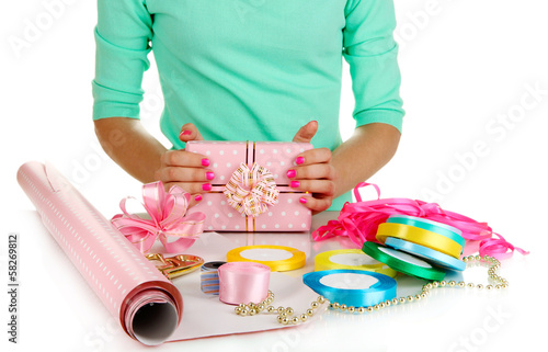 Photo: Packaging and decoration festive gift isolated on white Packaging and decoration festive gift isolated on white