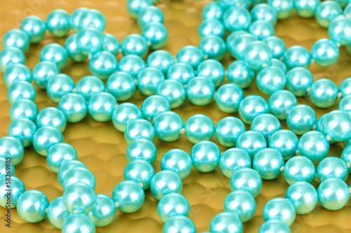 Photo: Color beads on bright background, close-up Color beads on bright background, close-up