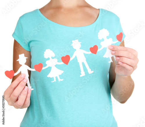 Photo: Paper people in hands isolated on white Paper people in hands isolated on white