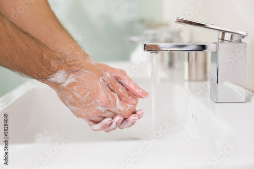 Photo: Washing of hands with soap under running water Washing of hands with soap under running water