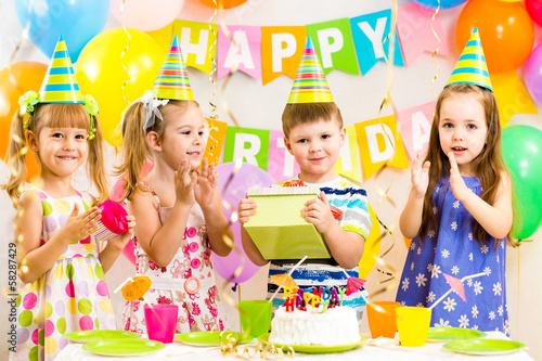 Photo: happy children celebrating birthday holiday happy children celebrating birthday holiday