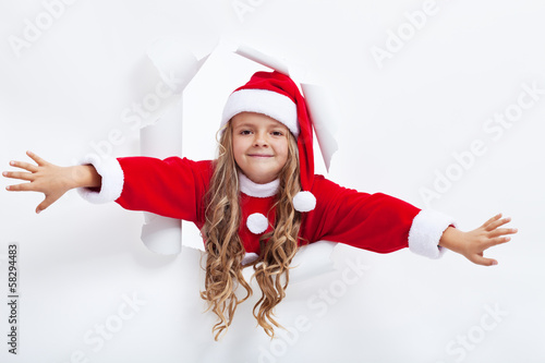 Photo: Happy santa girl opening the holidays season Happy santa girl opening the holidays season