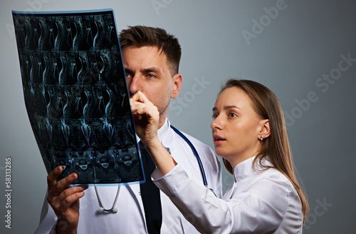Photo: Medical doctors team with MRI spinal scan Medical doctors team with MRI spinal scan