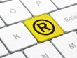 Law concept: Registered on computer keyboard background Law concept: Registered on computer keyboard background