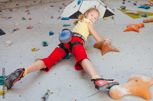 Photo: teenager climbing a rock wall teenager climbing a rock wall