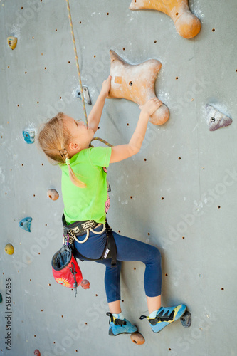 Photo: Little Girl Climbing Rock Wall Little Girl Climbing Rock Wall