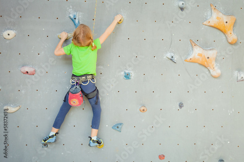 Photo: Little Girl Climbing Rock Wall Little Girl Climbing Rock Wall