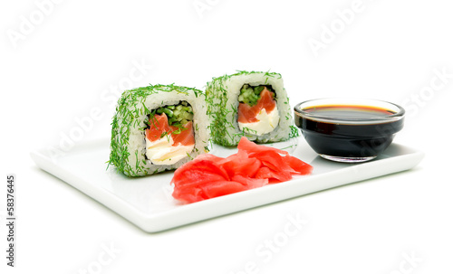Photo: Japanese cuisine - rolls, pickled ginger and soy sauce on a whit Japanese cuisine - rolls, pickled ginger and soy sauce on a whit