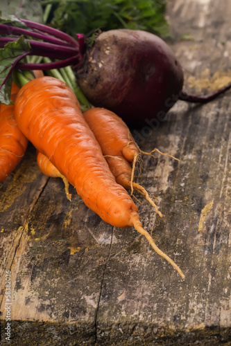 Photo: Fresh carrot and beetroot on table Fresh carrot and beetroot on table