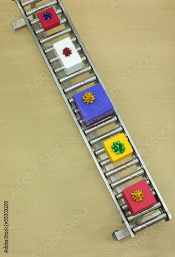 Photo: boxes on conveyor belt in Christmas gifts factory boxes on conveyor belt in Christmas gifts factory