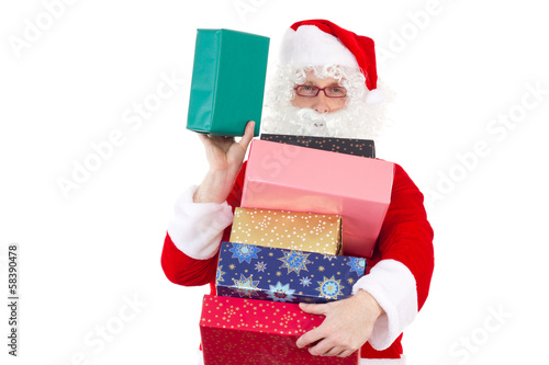 Photo: Santa Claus spreading lot of gifts to nice children Santa Claus spreading lot of gifts to nice children
