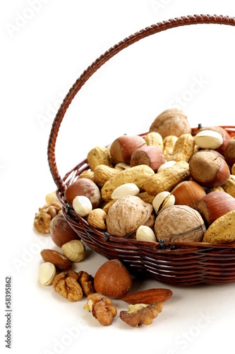 Photo: Assortment of different nuts (peanuts, hazelnuts) Assortment of different nuts (peanuts, hazelnuts)