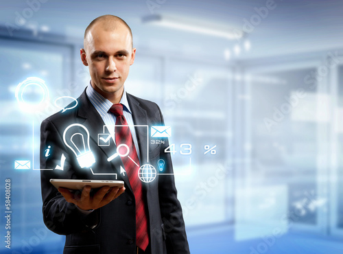 Photo: Businessman with tablet pc Businessman with tablet pc