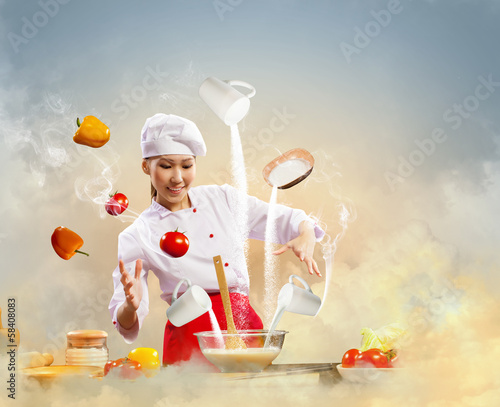 Photo: Asian female cooking with magic Asian female cooking with magic