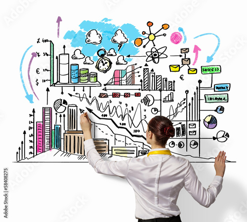 Photo: Businesswoman drawing on wall Businesswoman drawing on wall