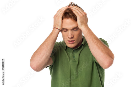 Photo: Man having severe headache Man having severe headache