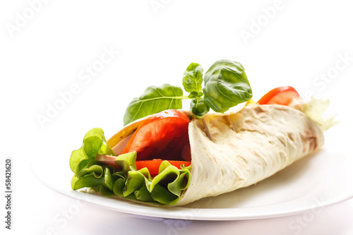 Photo: pita bread with lettuce, salami and tomatoes pita bread with lettuce, salami and tomatoes