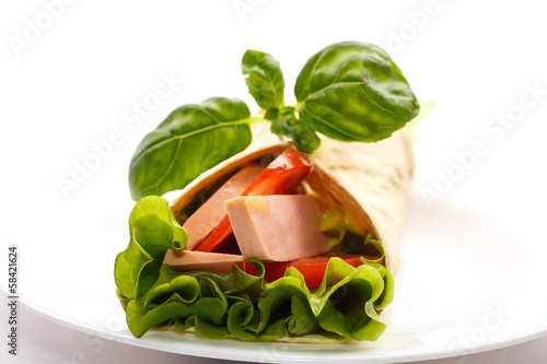 Photo: pita bread with lettuce, salami and tomatoes pita bread with lettuce, salami and tomatoes