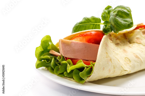 Photo: pita bread with lettuce, salami and tomatoes pita bread with lettuce, salami and tomatoes