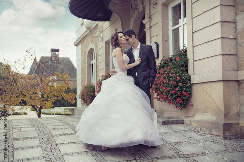 Photo: Young wedding couple dancing outdoor Young wedding couple dancing outdoor