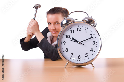 Photo: Woman trying to break the clock Woman trying to break the clock