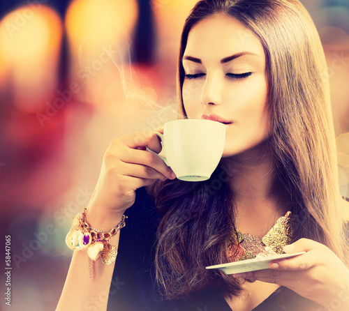 Photo: Coffee. Beautiful Girl Drinking Tea or Coffee Coffee. Beautiful Girl Drinking Tea or Coffee